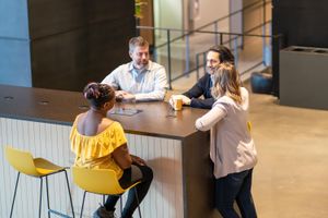 Ann, Jeff, Pablo, and Kimberley catching up over a coffee - our thing - in Calgary's Ampersand building lobby.