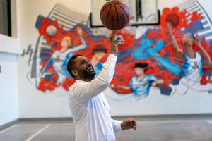 Jessie spinning a basketball on his finger